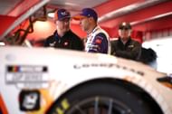 Crew chief Christopher Gabehart and Denny Hamlin at the Joe Gibbs garage area. Source: Getty